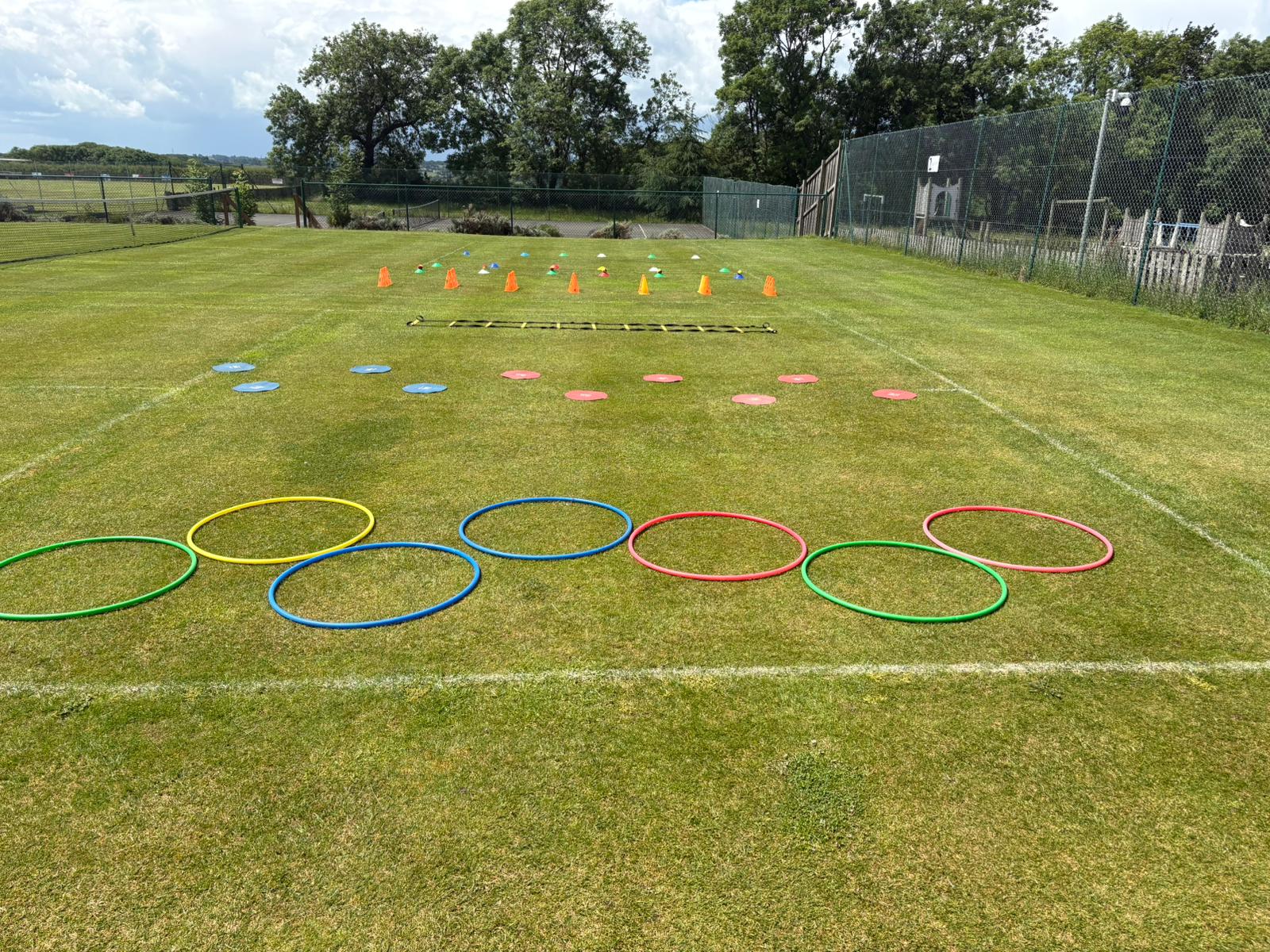 Movement circuit set up on the grass court, ready for the Richardson Endowed Primary School coaching session.