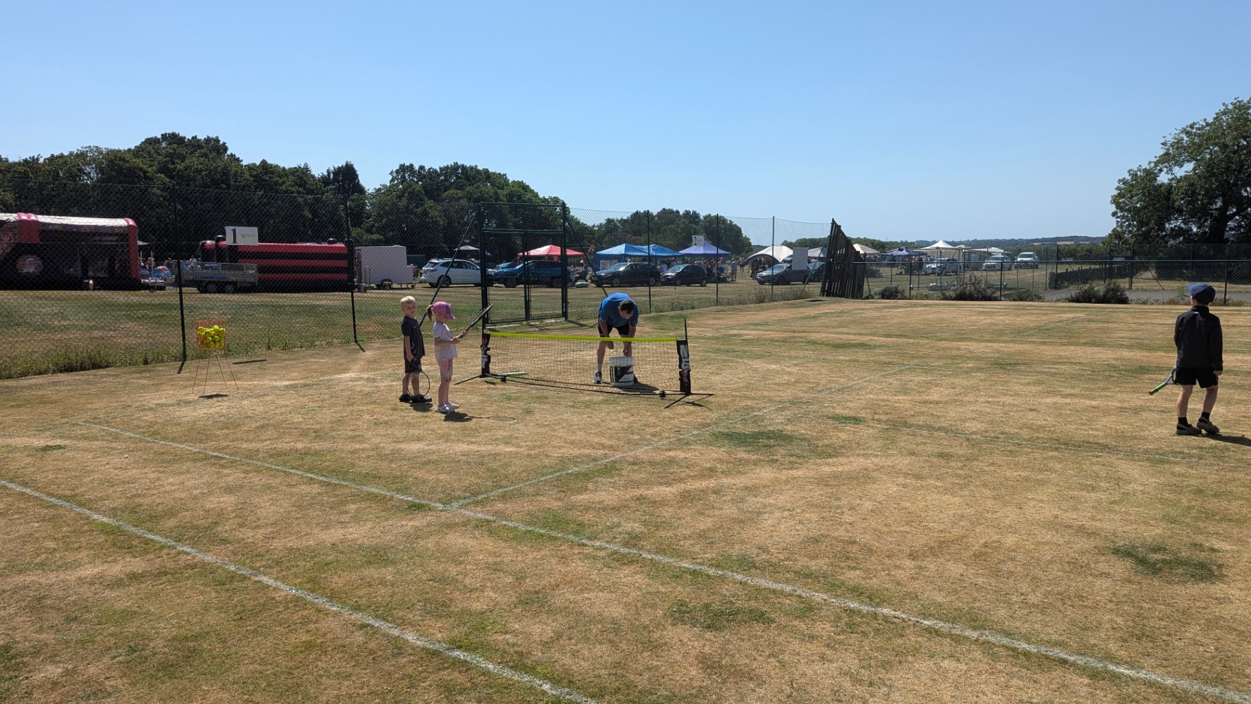 Coach working with juniors at the mini-net