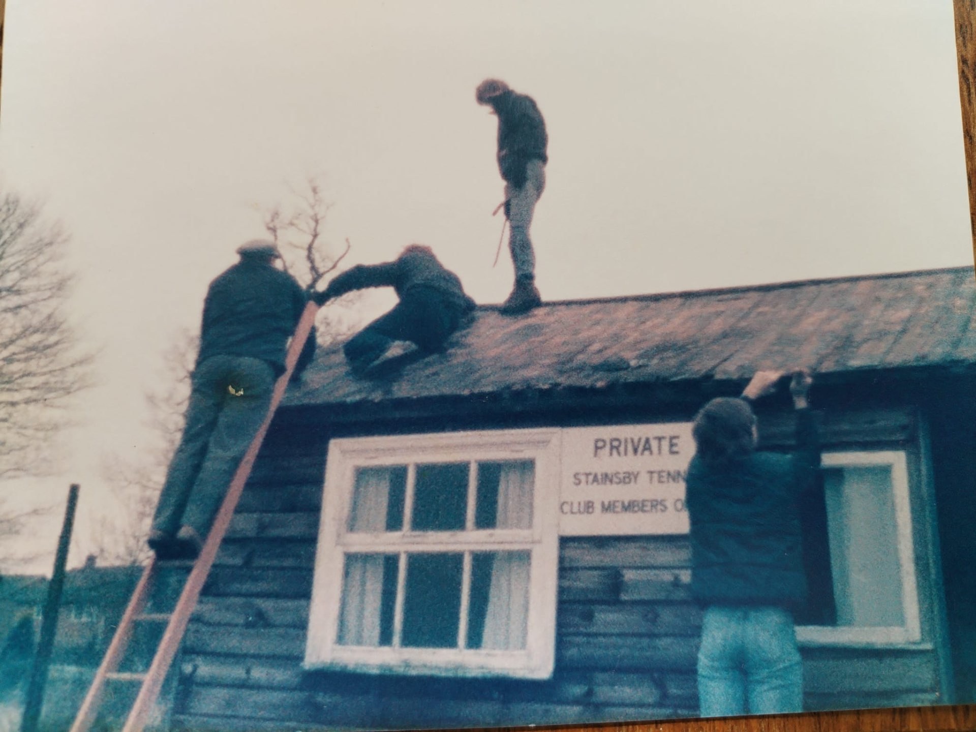 Members repairing the roof of the original Stainsby Tennis Club pavilion