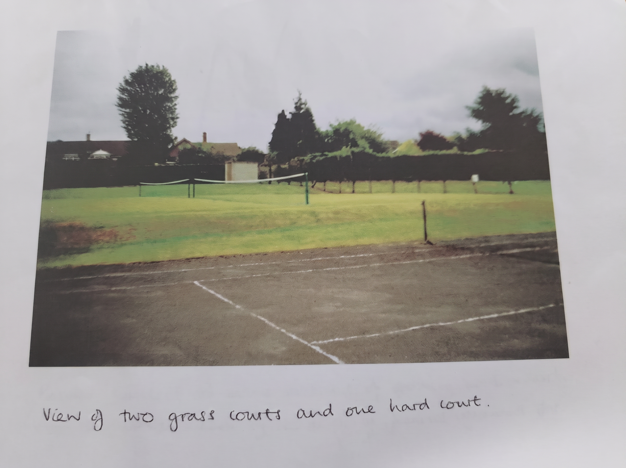 View of the two grass courts and one hard court at Smalley
